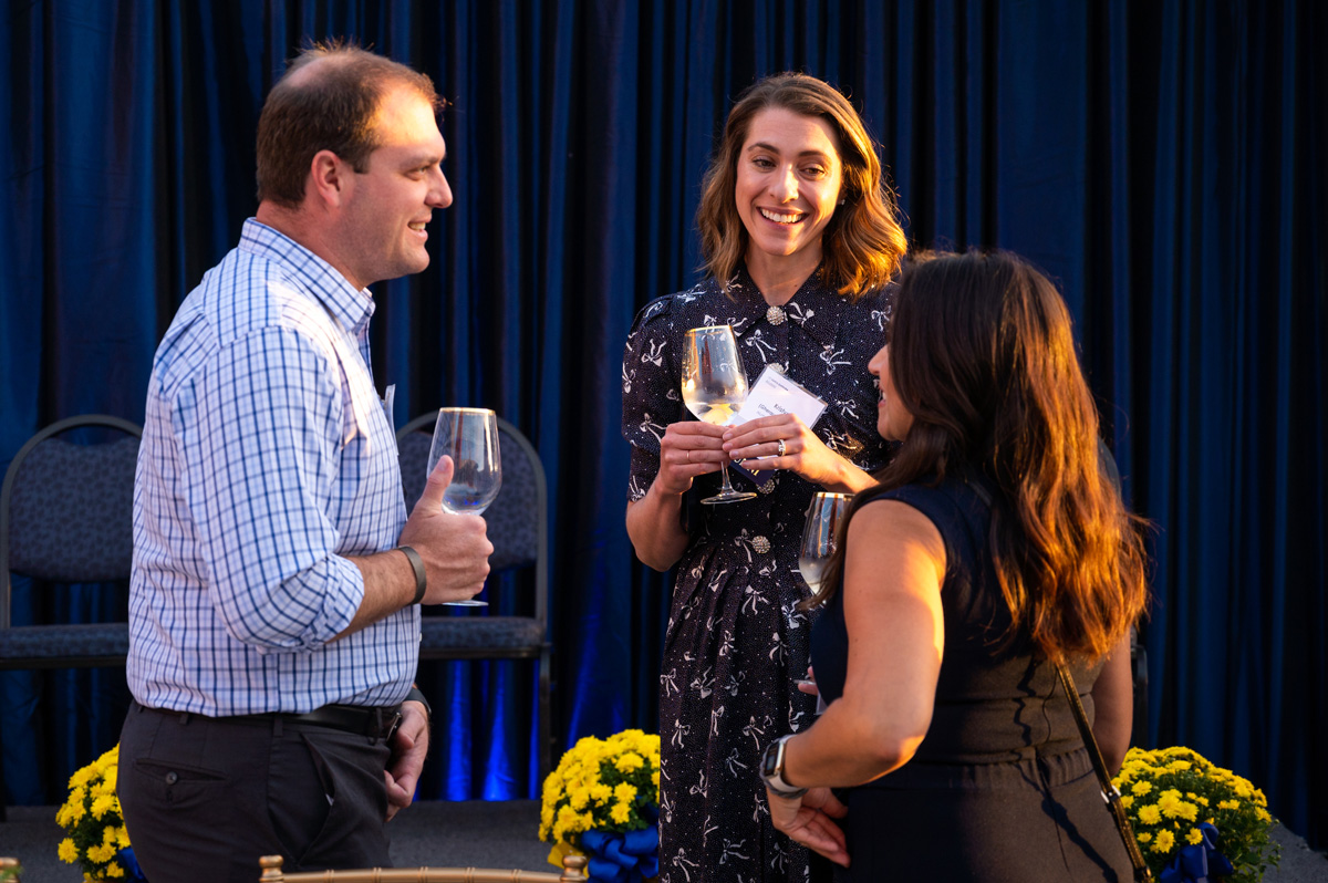 Three individuals in conversation