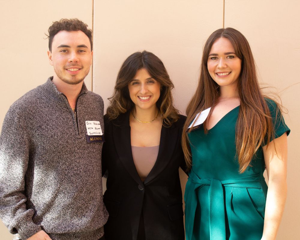 Three people smiling for the camera
