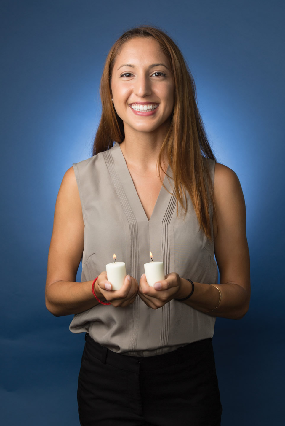 woman holding candles