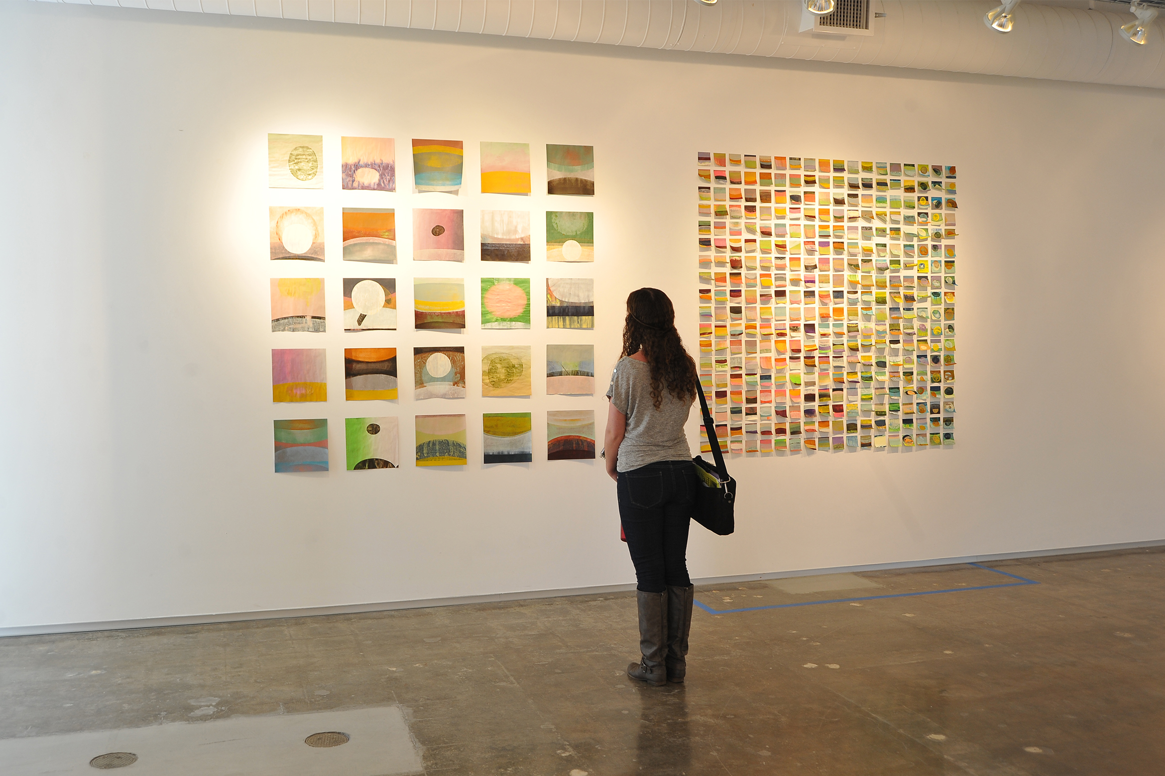 A student looking at an art installation at the Art Museum