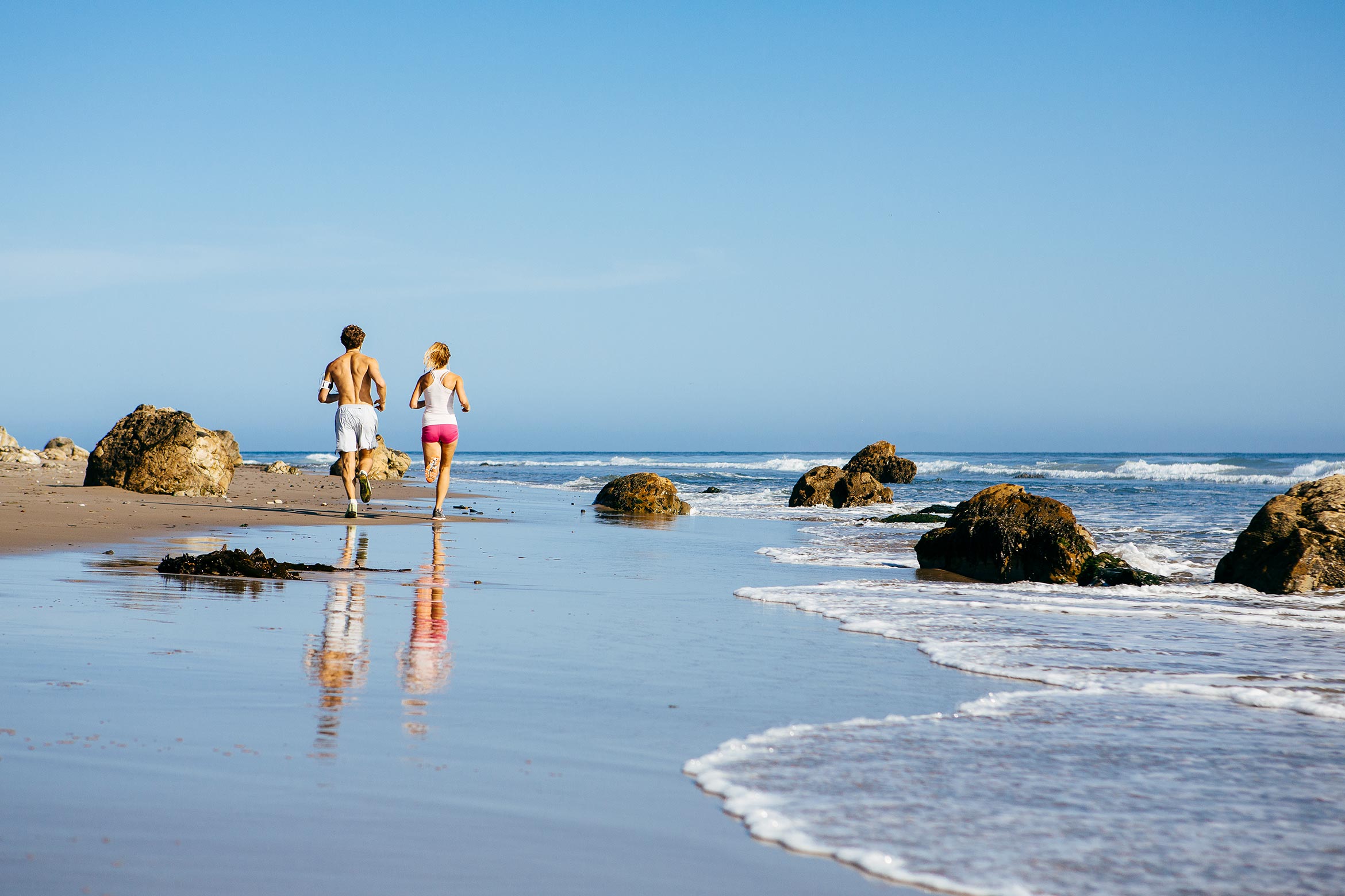 people running on beach