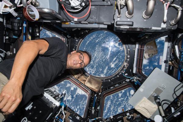 NASA astronaut Joe Acaba works inside the cupola as the space station orbits above the Indian Ocean near Australia. Photo: NASA Johnson